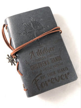 Load image into Gallery viewer, A Mother Holds Her Childrens Hand Engraved Journal
